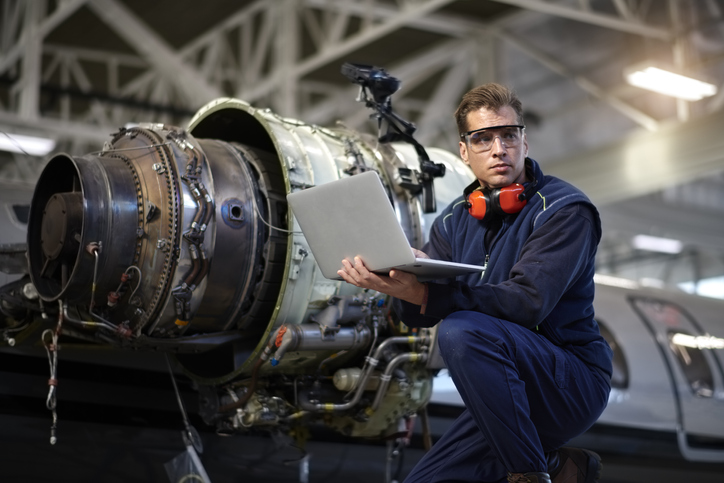 Aircraft mechanic in the hangar - Extrude Hone AFM